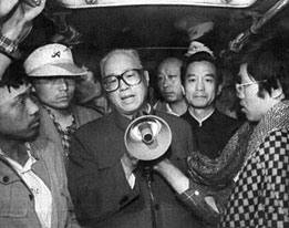 Zhao speaks during the 1989 Democracy Protests. Behind him (2nd from right in black) is current  Premier .