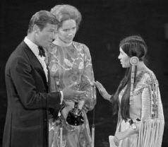 Sacheen Littlefeather with  and  at the 1973 Academy Awards