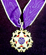 The medal is presented ceremonially as a neck order.