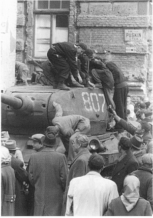 Hungarians investigate a disabled Soviet tank in 