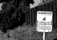 A photograph of a Neighborhood Watch sign in black and white