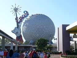Spaceship Earth, as seen from outside the vistor's entrance. It is the symbol of Epcot. 's magic wand and the Walt Disney World  track are visible beside it.