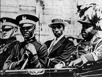 Marcus Garvey (far right) in parade