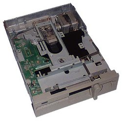 A user inserts the floppy disk, medium opening first, into a 5¼-inch floppy disk drive (pictured, an internal model) and moves the lever down (by twisting on this model) to close the drive and engage the motor and heads with the disk.