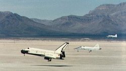 STS-3 prepares to land at Northrup Strip,  with two  chase planes observing.