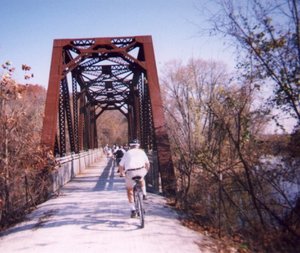 Cyclists cross an erstwhile railroad bridge on an eastern part of the Katy Trail.