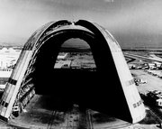 View of the huge dirigible hangar with doors open at both ends.