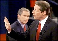Al Gore makes a point during a debate with George W. Bush.