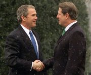 Al Gore greets President-Elect Bush at the White House in late December of 2000.