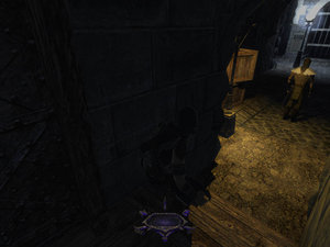 Garrett hides in a shadowy hallway as he ponders his next move in Thief: Deadly Shadows