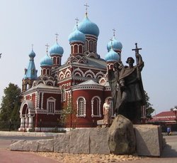 Monument to Prince Boris Vseslavovich in front of an Orthodox church
