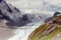 Austria's longest glacier, the Pasterze, winds its 8 km (5 mile) route at the foot of Austria's highest mountain, the .