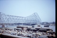 The Howrah Bridge which spans the Hughli River, links  to Kolkata.