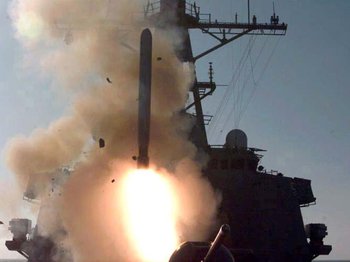 A Tomahawk cruise missile (TLAM) is fired from an Arleigh Burke-class destroyer during the fourth wave of attacks on Iraq.