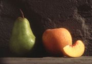 Larger pear with peach and peach slice