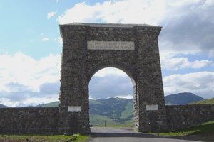 North Gate to Yellowstone Park at Gardiner, Montana which says "For the Benefit and Enjoyment of the People"