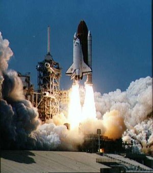 The Space Shuttle Columbia seconds after engine ignition, 1981 (NASA). For the first two missions only, the external fuel tank was painted white. Subsequent missions have featured an orange fuel tank, painted in primer only to conserve over 500kg in weight.