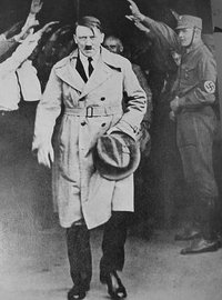 Hitler walking out of Brown House after 1930 elections