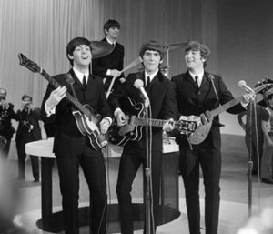 Originally, The Beatles' work focused around themes of optimistic, giddy, love akin to that of a boy who had just fallen in love, as typified by their performances of songs on The Ed Sullivan Show, such as "All My Loving", "" and "".