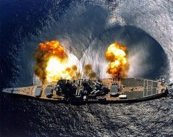 The battleship  firing a salvo to starboard