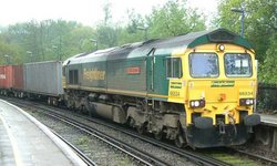 The new order - , no. 66534 "OOCL Express", in the new Freightliner livery, seen at Virginia Water station, , April 2004.