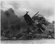 The USS Arizona, aflame and sinking, on December 7, 1941