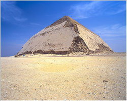 The southern or "Bent" Pyramid of Sneferu at Dahshur. Uniquely, this pyramid retains much of its original polished limestone casing.