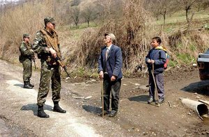 Ukrainian soldier on foot patrolling in Serbian village near 