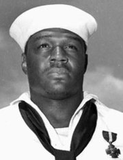 U.S. Navy Cook Third Class Doris Miller, Navy Cross for actions in Pearl Harbor ( ).
