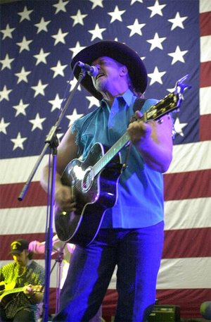 Trace Adkins performs at a USO concert