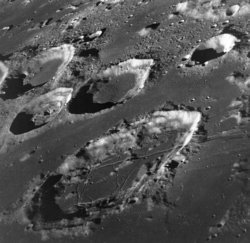 A portion of the lunar near side. The large crater in the bottom half of the photo is .