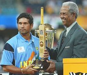  handing over the Man of Tournament trophy to Sachin Tendulkar at the 2003 World Cup