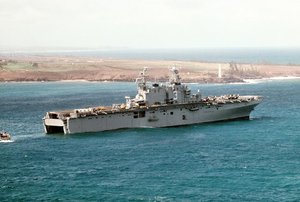 USS Belleau Wood prepares to receive a Marine landing craft