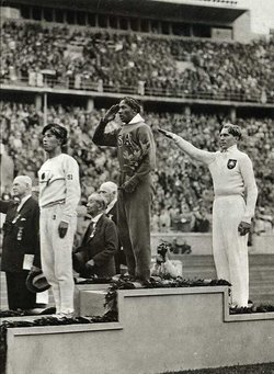 Medal ceremony for the long jump at the 1936 Olympics with Tajima, Owens and Lutz Long.