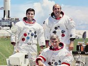 Ronald Evans (right) poses with  (left) and  (seated) for an Apollo 17 publicity photo