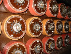 The Bombe replicated the action of several Enigma machines wired together. Each of the rapidly rotating drums, pictured above in a  museum mockup, simulated the action of an Enigma rotor.