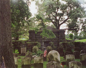 Irving's grave, marked by the flag, in , .