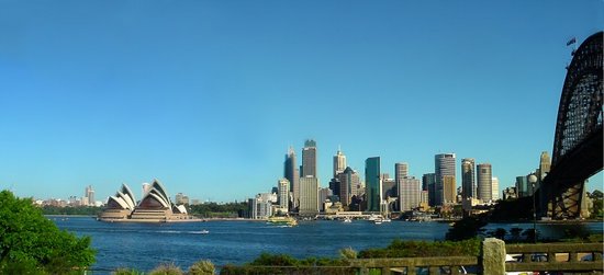 A view of Sydney Harbour, with the Sydney Opera House on the left, the central business district in the image centre and Sydney Harbour Bridge on the right