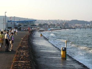 Paignton seafront in the late evening, at high tide