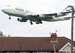 An Iranair Boeing 747-100 lands over the houses at London (Heathrow) Airport