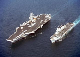 , a typical supercarrier, and , a light   on a joint patrol. The Stennis is much larger in every dimension.