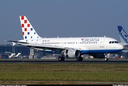 Croatia Airlines Airbus A319-100 near a Nippon Cargo Airways 747, at Amsterdam (Schiphol) Airport, the Netherlands.
