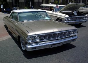 Two 1964 Ford Galaxies; the Country Sedan model is at the right
