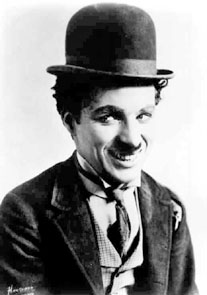 Chaplin in his costume as "The Tramp"