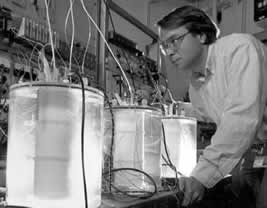 Charles Bennett examines three "cold fusion" test cells at the Oak Ridge National Laboratory, USA
