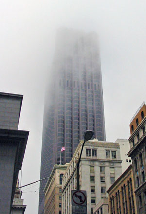 The Bank of America Center as seen from Pine Street, disappearing into the morning fog.