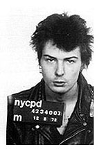 Sid Vicious in a  Mugshot, when he was arrested for the murder of his girlfriend, .