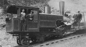 A cog steam locomotive showing the tilted boiler level on steeply graded track