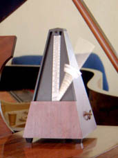 A mechanical wind-up metronome in motion