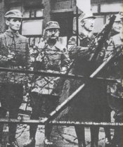 Himmler (third from left, holding a flag) during the Beer Hall Putsch 1923